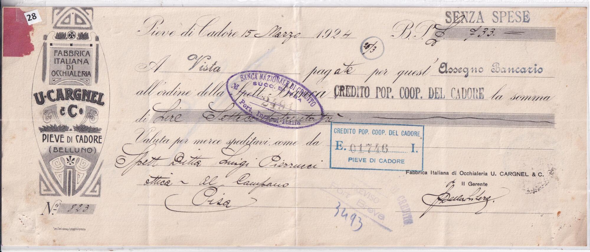 28 A Assegno bancario N. 823 B.P.Lire 733 emesso il 15 marzo 1924 da U. CARGNEL e C. Fabbrica italiana di occhialeria in favore di CREDITO POP. COOP. DEL CADORE Valuta per merce spedita come da Spett.le Ditta Luigi Pierucci Ottica Al Campano Pisa